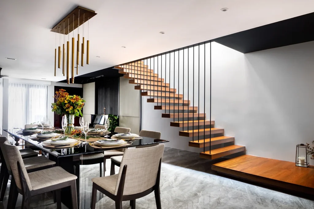 Dining table with staircase in background